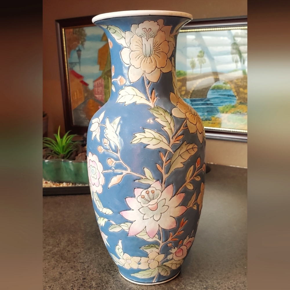 Ceramic, floral vase. Semi gloss finish. Colorful flowers with leaves and buds.